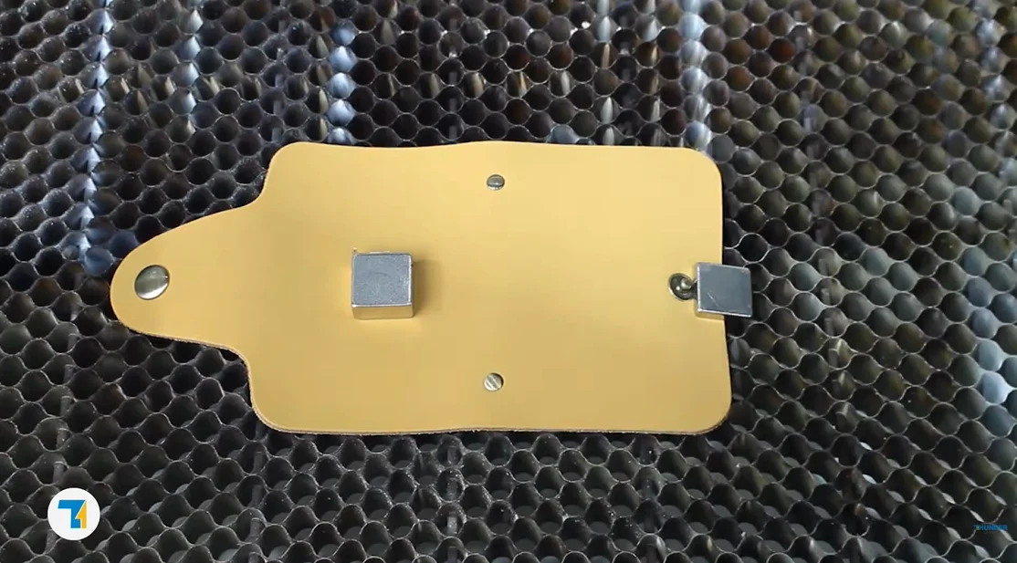 put the leather card holder on the laser bed.webp