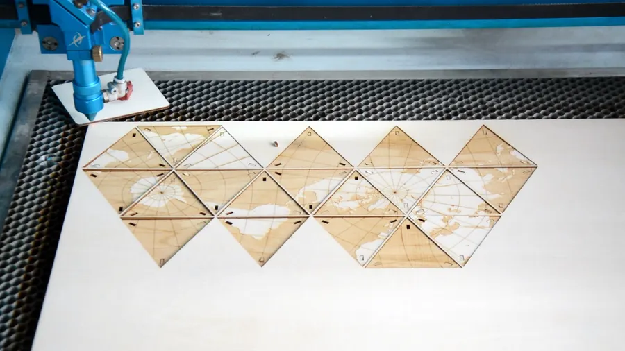 laser cut the wooden globe.webp