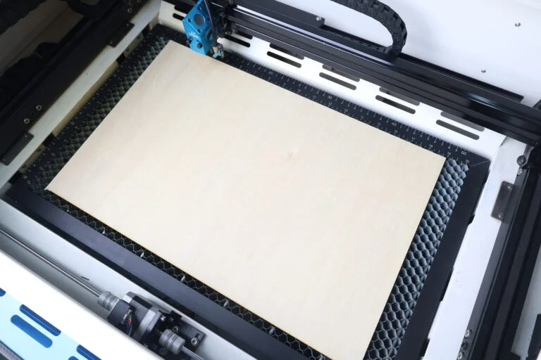 put the wood on the laser bed
